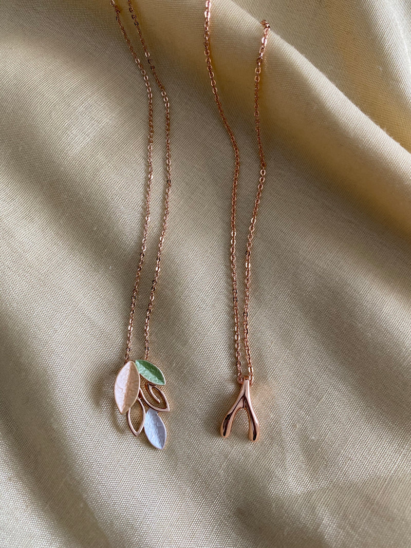 Rose Gold Necklaces on Fabric