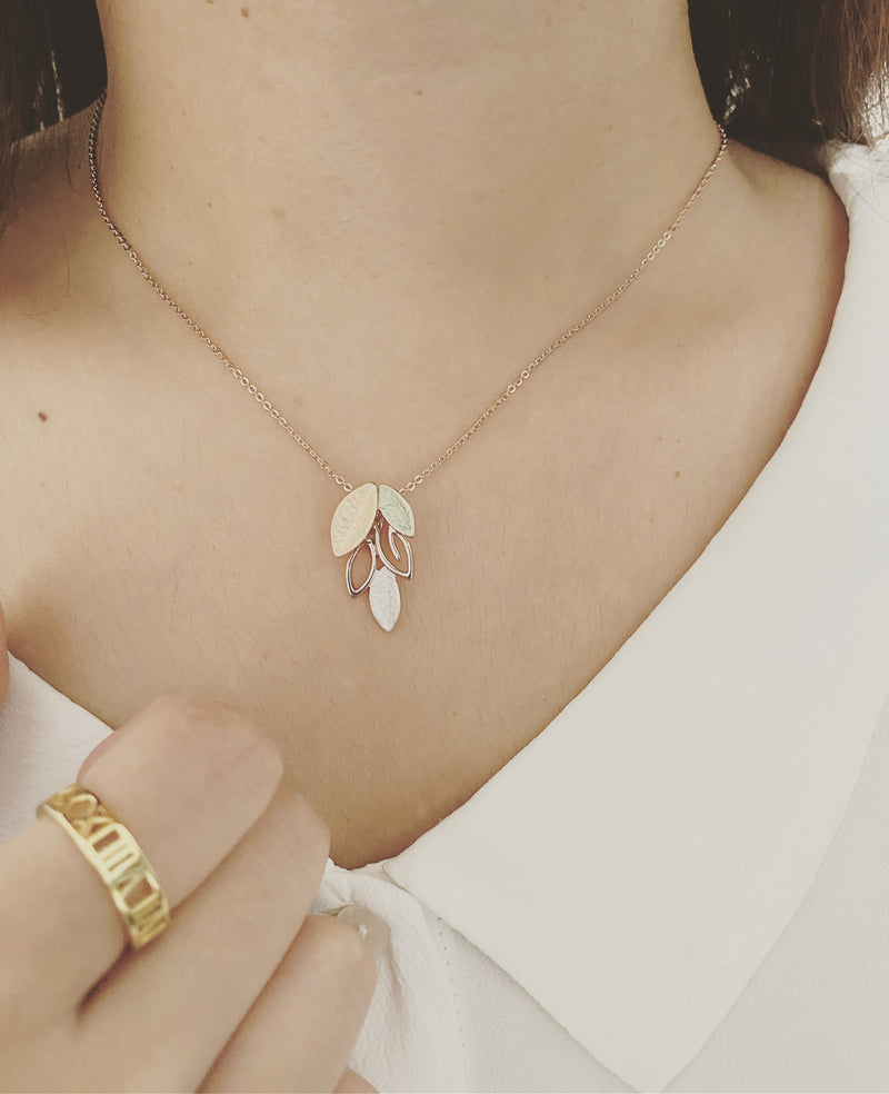 Rose Gold leaf pendant  and roman numeral ring lifestyle 